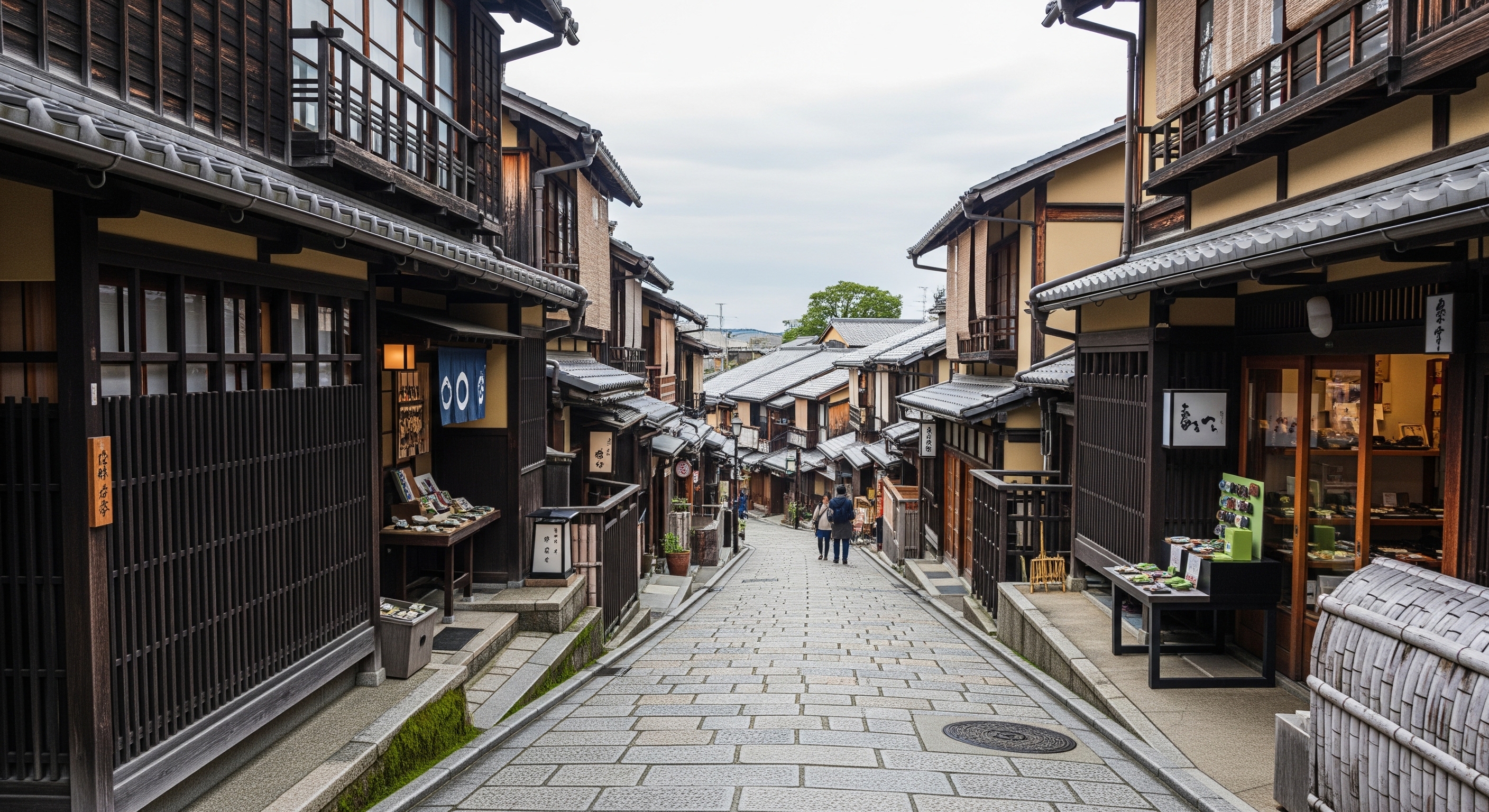 Traditional stone-paved Sannenzaka lane lined with machiya townhouses and souvenir shops in Higashiyama Kyoto