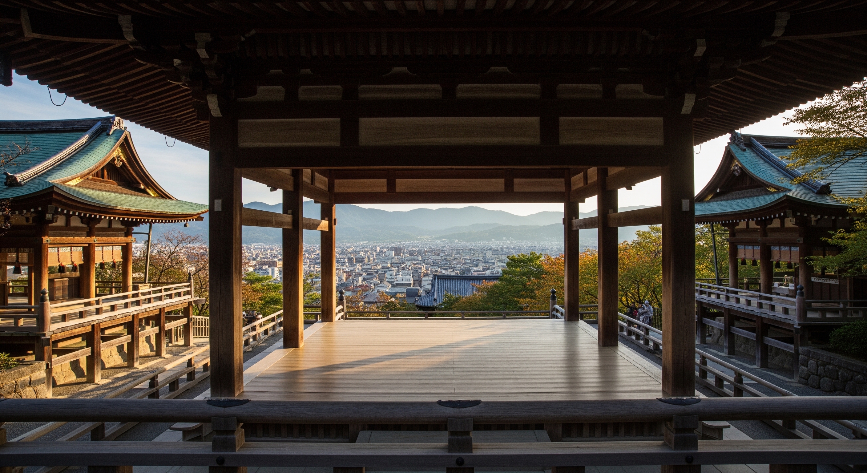 Kiyomizudera wooden stage jutting from the main hall with views over Kyoto's eastern hills and forested slopes