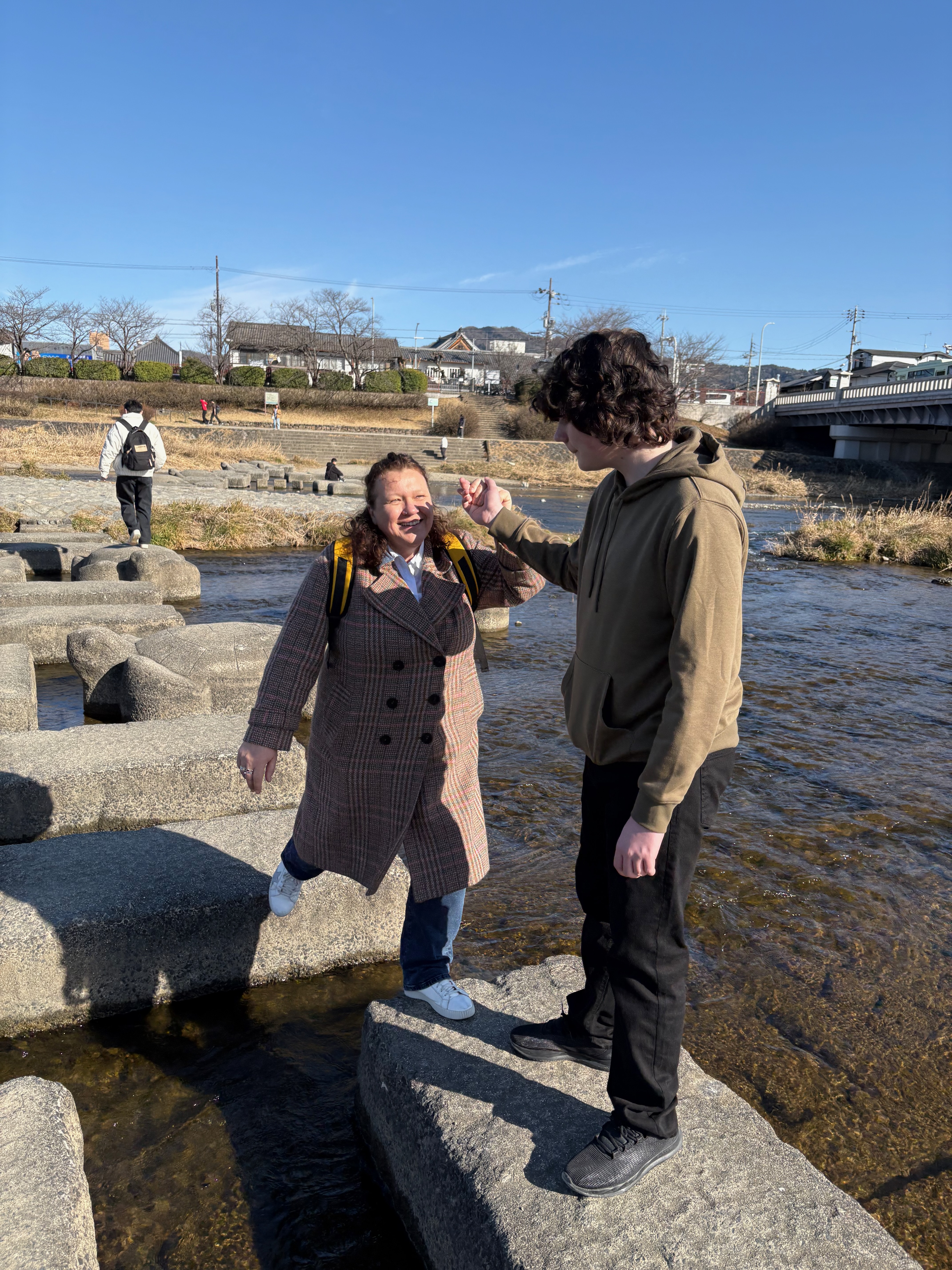 Guests on stepping stones at Kamogawa Delta