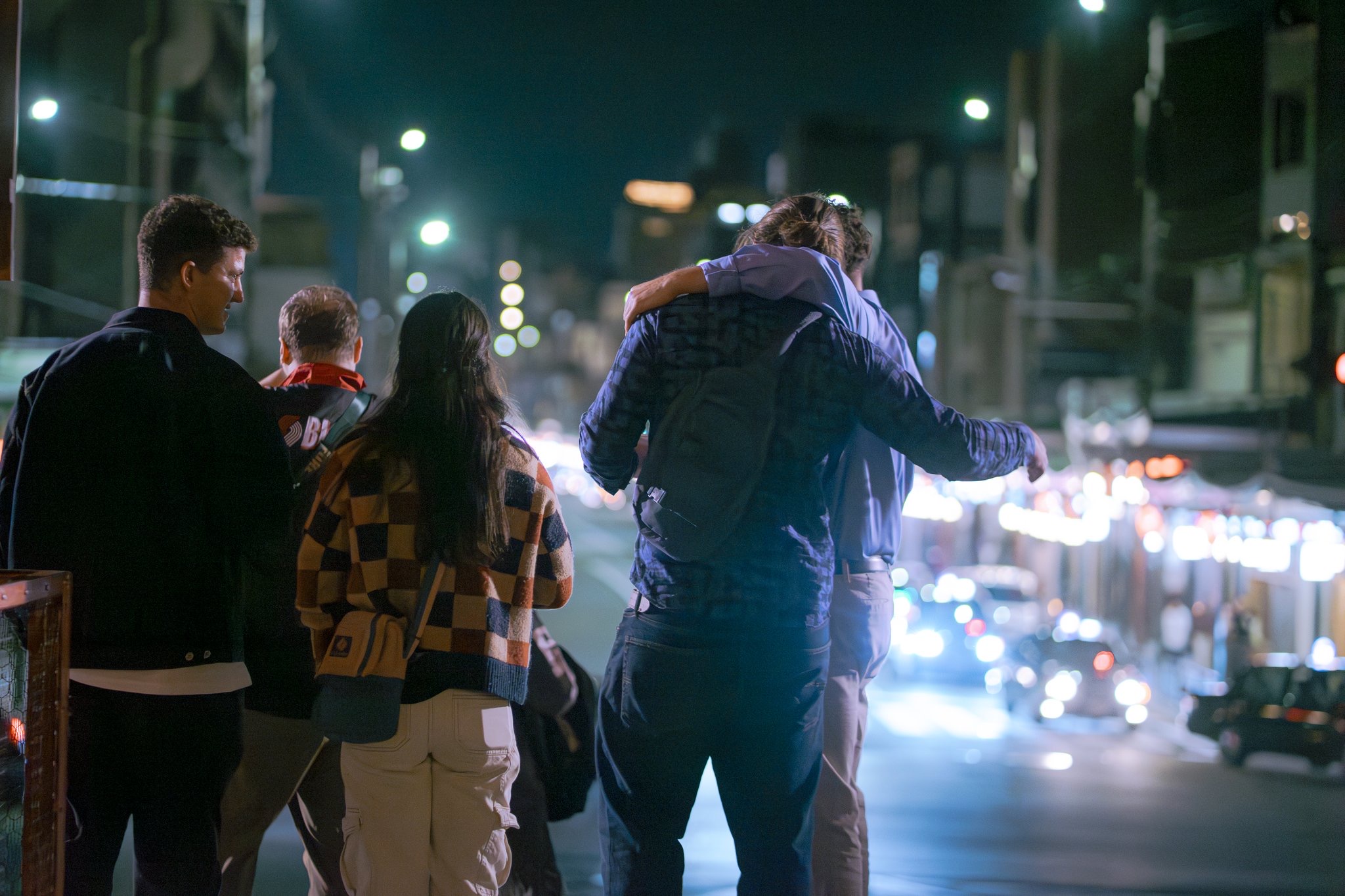 Group walking through Kyoto at night