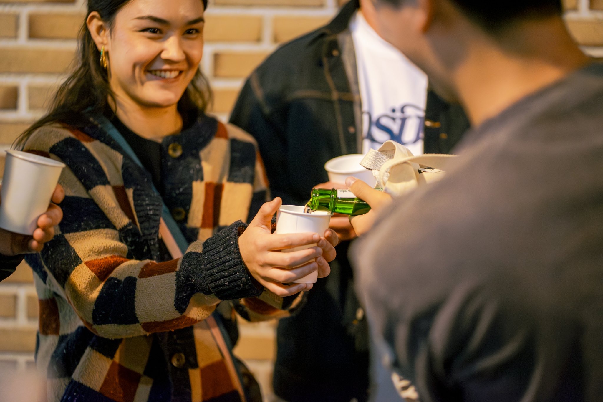 Sake being poured at a local bar