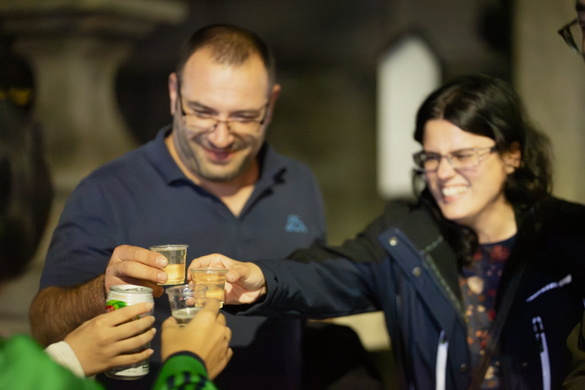 Guests toasting with sake shots