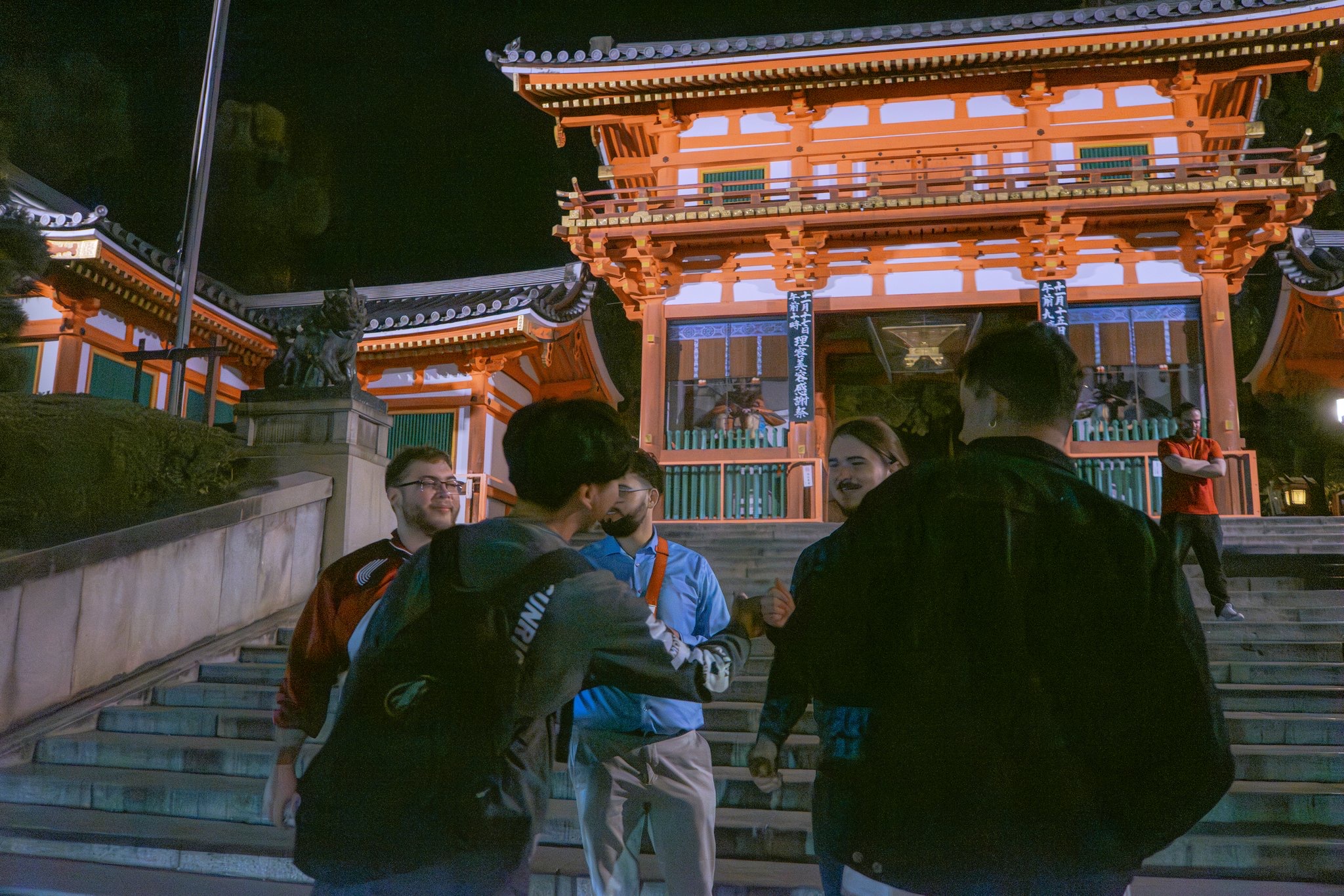 Group at Yasaka Shrine gate at night